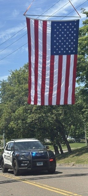 torch run flag and police car